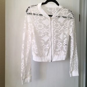Women's white lace sheer long sleeved zipper top. Size M.